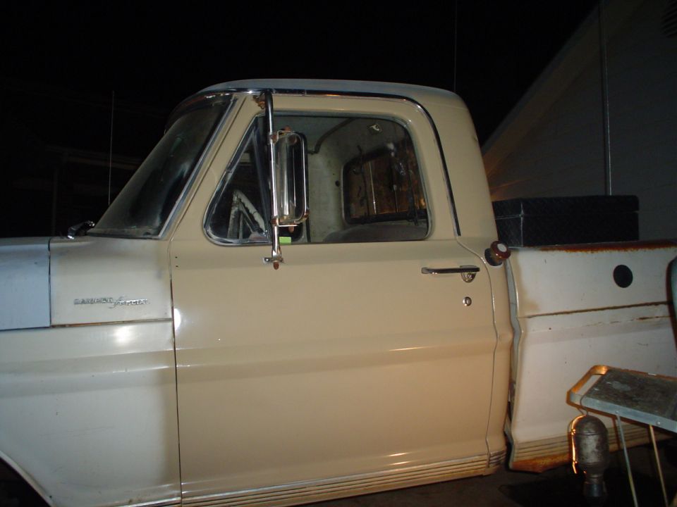 1967 Ford F-250 side view of cab and bed, showing door, mirror, and toolbox