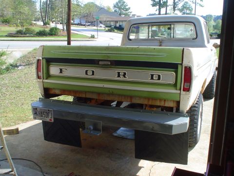 1967 Ford F-250 - This pickup truck features a two-tone green and white paint scheme with prominent 'FORD' badging on the tailgate.