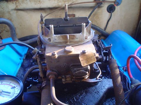 1967 Ford F-250 - A carburetor is shown with a pressure gauge connected to the engine.