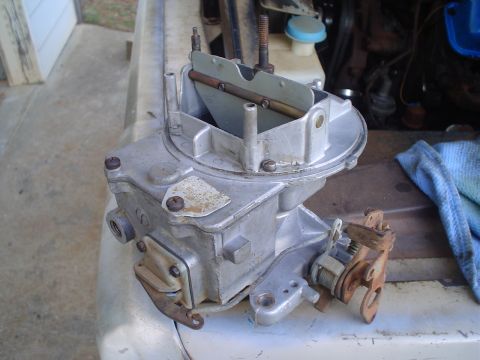 1967 Ford F-250 - Close-up view of a carburetor, likely from an older vehicle's engine bay.