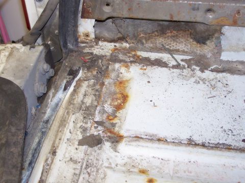 1986 Ford Bronco - The interior floor pan of this 1986 Ford Bronco shows significant rust and corrosion.