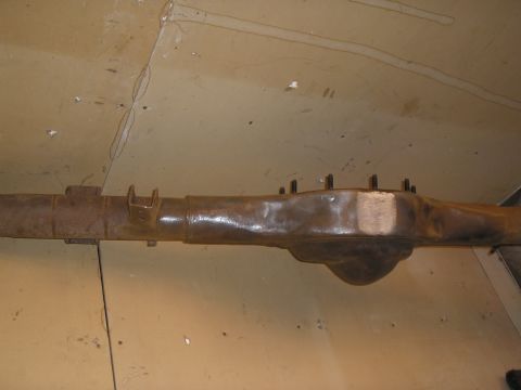 1990 Ford Bronco - Close-up of a rusty rear axle housing, likely from an older vehicle.