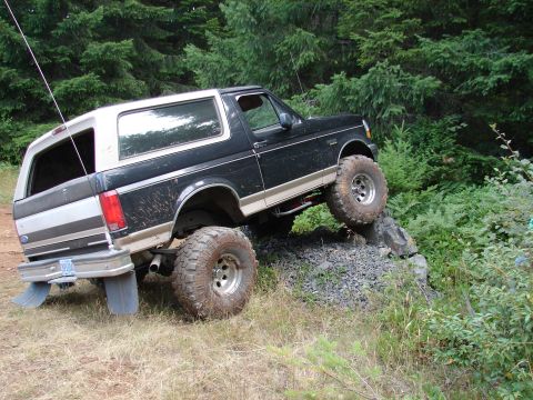 1996 Ford Bronco - This 1996 Ford Bronco is navigating a challenging rocky trail with its lifted suspension.