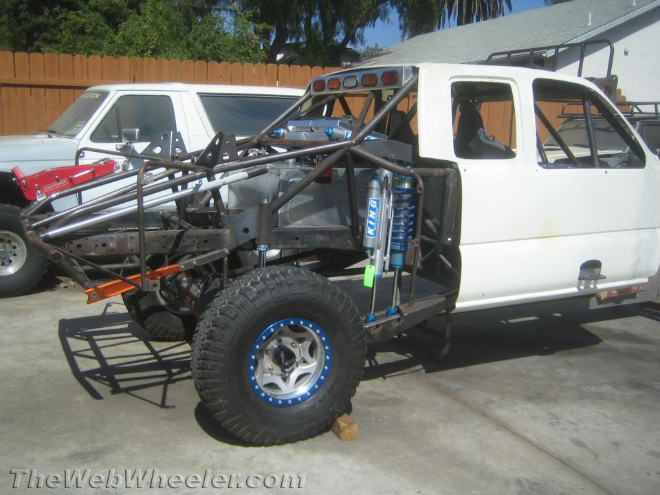 White off-road prerunner truck on a tube chassis with King coilover shock