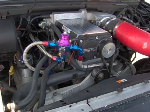 1991 Ford Taurus - Engine bay details show a Kenne Bell supercharger and associated fuel system components.