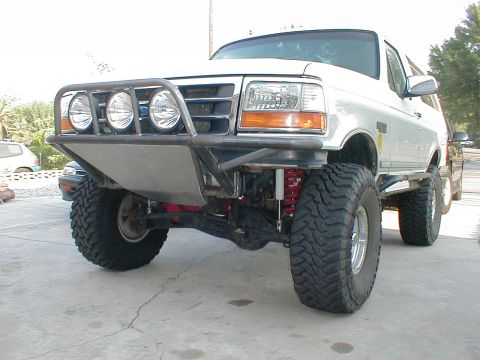 1996 Ford Bronco - This modified Ford Bronco features a custom bumper and large off-road tires.