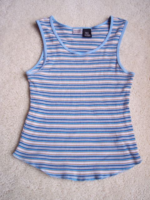 1968 Chrysler Town & Country - A close-up view of a blue and white striped tank top with light blue trim and a tag inside the neckline.