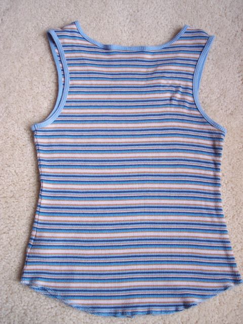 1968 Chrysler Town & Country - A close-up view of a horizontally striped tank top, showing its ribbed texture and hemline.