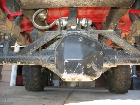 1970 Ford Bronco - Close-up of a vehicle's rear axle and suspension components, showing the differential.