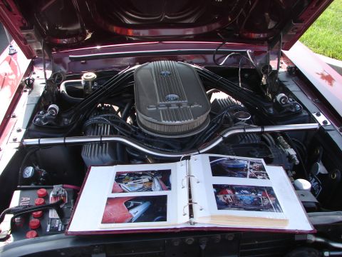 1992 Ford Taurus - An open photo album displays images of car parts within the engine bay of a vehicle.