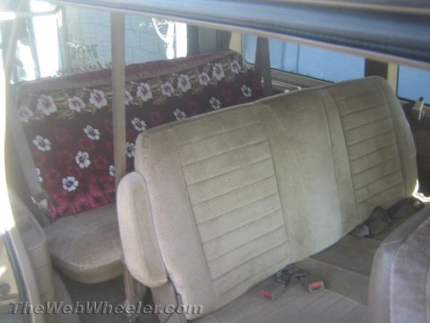 1968 Ford Mustang - Interior view of a vehicle showing front and rear seating arrangements with seatbelts.