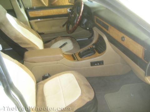 1968 Ford Mustang - Interior view of a car with tan and brown upholstery and wood grain accents on the dash.