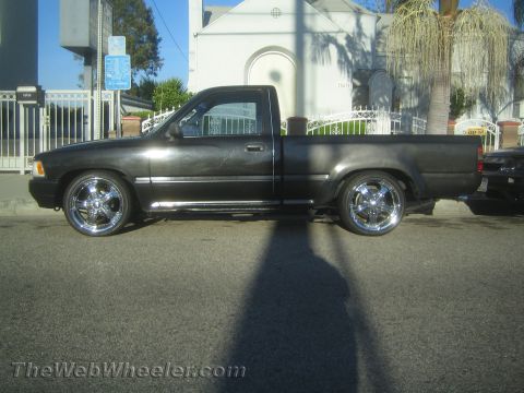 1968 Ford Mustang - This pickup truck is customized with aftermarket wheels and a lowered suspension.