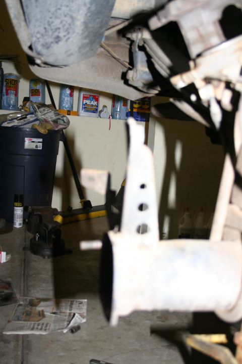 1978 Ford Bronco - Close-up view of vehicle undercarriage components in a garage environment.