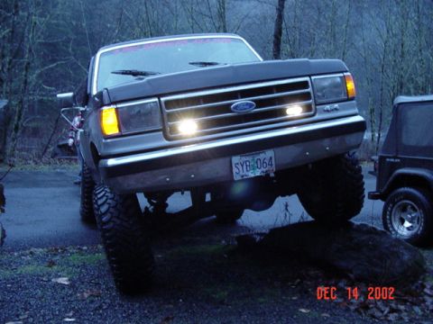1989 Ford Bronco - Ford Bronco parked outdoors with a Jeep Wrangler visible in the background.