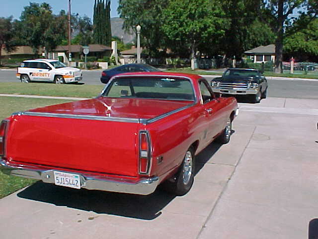 Red 1970 Ford Ranchero pickup truck, rear view, chrome trim, license plate 5J15442