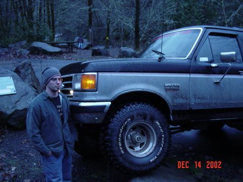 1989 Ford Bronco - A man stands next to a two-tone Ford Bronco. The photo is dated December 14, 2002.