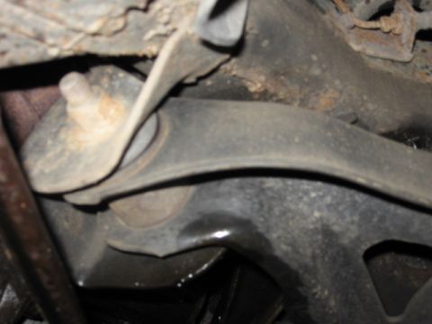 1992 Ford Crown Victoria - A close-up view of a vehicle's undercarriage, focusing on a suspension component.