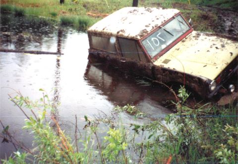 1978 Ford Bronco - This off-road vehicle appears to be stuck in a muddy body of water, with the number '105' scrawled on its windshield.