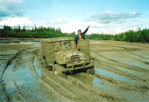 1978 Ford Bronco - This vehicle is completely covered in mud after getting stuck in a challenging off-road terrain.