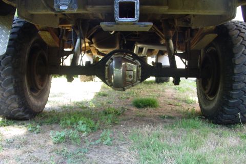 1993 Ford Bronco - Undercarriage view showing the rear axle assembly and suspension components of a truck.