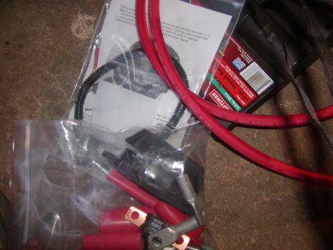 1991 Ford Bronco - Various automotive battery cables and connection terminals are shown, including red welding cable and ring terminals.