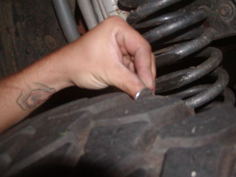 1991 Ford Bronco - Checking tire tread depth with a coin is a common method for off-road enthusiasts.