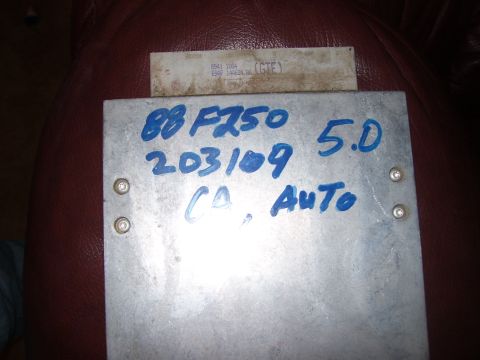 1986 Ford Bronco - An electronic control unit with handwritten markings indicating '88 F250 5.0 203109 CA Auto'.