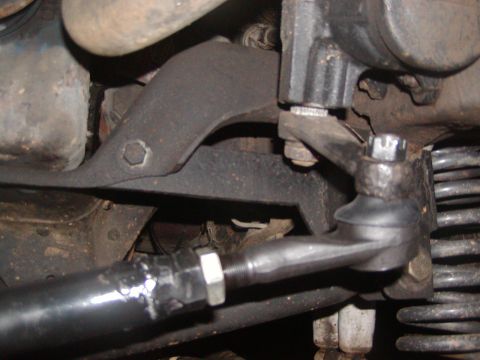 1991 Ford Bronco - Undercarriage view of a vehicle's steering and suspension system, showing mechanical components.