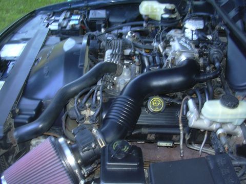 1996 Ford Crown Victoria - Aftermarket cone air filter installed in the engine bay, obscuring specific vehicle identification.