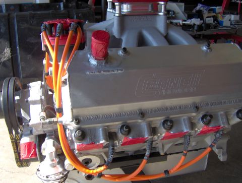 1978 Ford Bronco - Close-up of a Cornell Thunder engine, silver construction and bright orange spark plug wires.