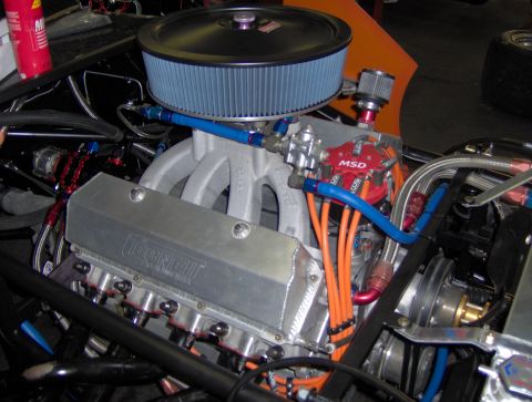 1978 Ford Bronco - Close-up view of a custom engine bay a large air filter, MSD ignition, and CORNELL branded valve covers.