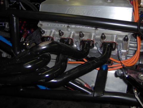 1978 Ford Bronco - Engine detail showing "CORNELL" valve cover, exhaust headers, and orange spark plug wires.