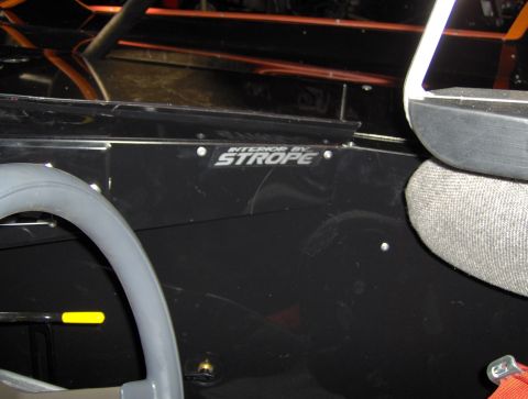 1978 Ford Bronco - Vehicle interior with roll cage and "INTERIOR BY STROPE" badging visible.