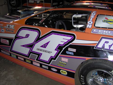 1978 Ford Bronco - Side view of a race car with sponsor decals and the number 24 prominently displayed.