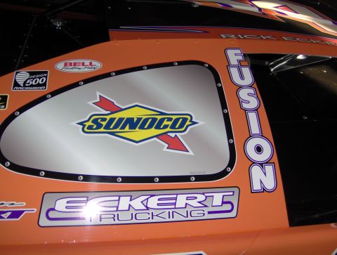 1978 Ford Bronco - Side panel of a racing vehicle displaying various sponsor logos and text.