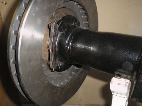 1990 Ford Bronco - This image shows a close-up view of a vehicle's rear axle and brake rotor assembly.