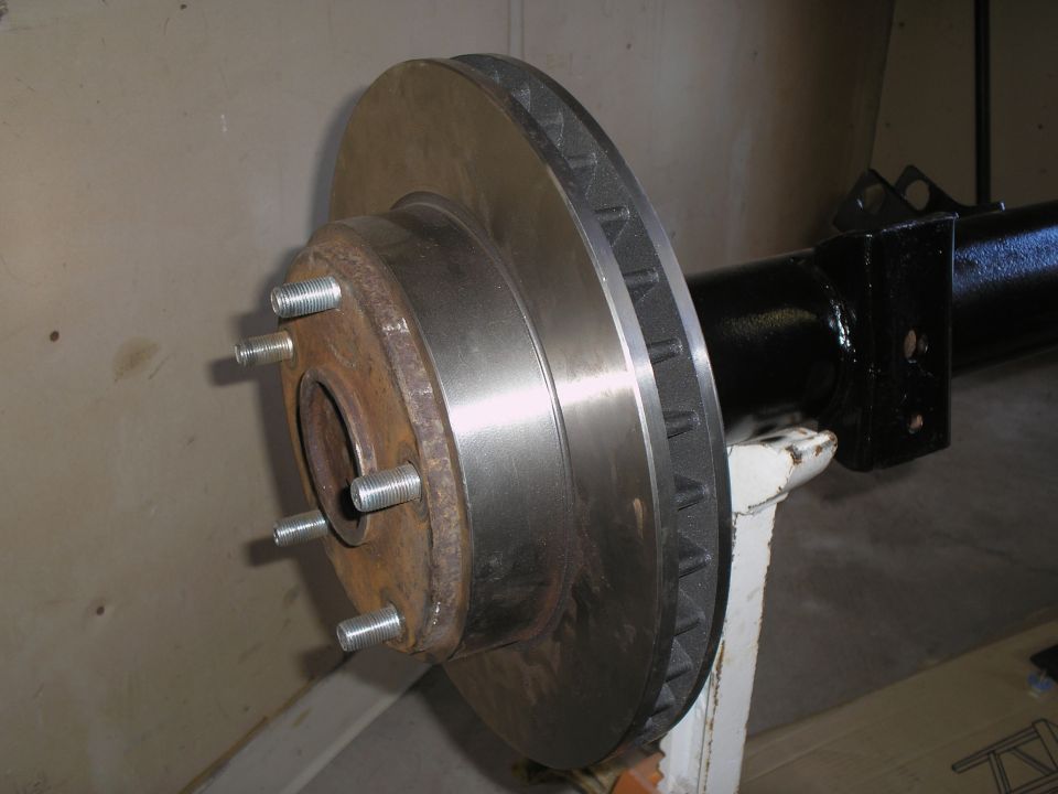 Axle assembly with brake rotor and studs