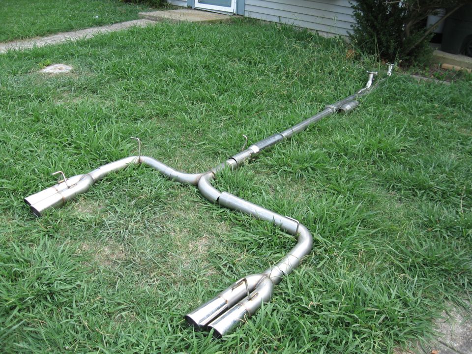 Dual exhaust system with chrome tips on grass
