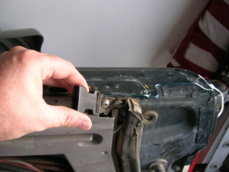 1995 Ford Bronco - Close-up of a hand manipulating a car's internal component, with a watermark from SuperMotors.net visible.