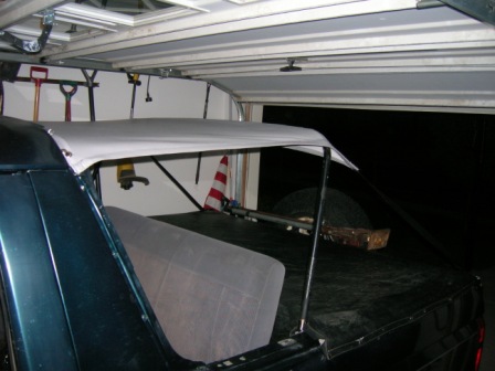 1995 Ford Bronco - Rear view of a 1995 Ford Bronco showing its soft top installation.