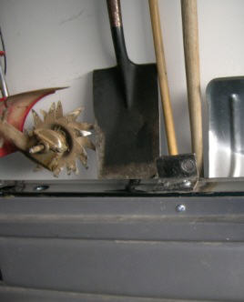 1995 Ford Bronco - Garden tools and a vehicle bumper are shown in this image with a SuperMotors.net logo.