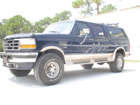 1993 Ford C-350 (Centurion Conversions) - This Ford F-350 Centurion Conversion SUV features a dark blue exterior with tan trim and BFGoodrich All-Terrain tires.