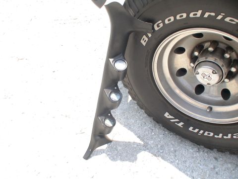 1993 Ford C-350 (Centurion Conversions) - A close-up of a gauge pod and a BFGoodrich tire, likely from a truck.