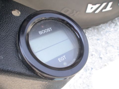 1993 Ford C-350 (Centurion Conversions) - Digital gauge displays BOOST and EGT readings, with 'DESIGN' visible on the bezel.