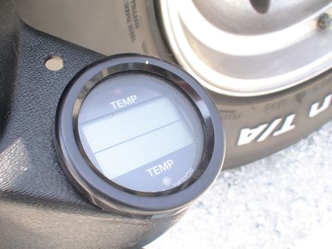 1993 Ford C-350 (Centurion Conversions) - A digital temperature gauge is visible next to a tire, with no clear indication of the vehicle's year or model.