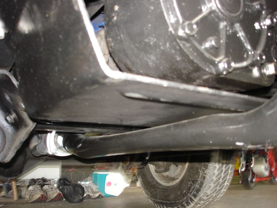 Undercarriage view showing suspension and drivetrain components