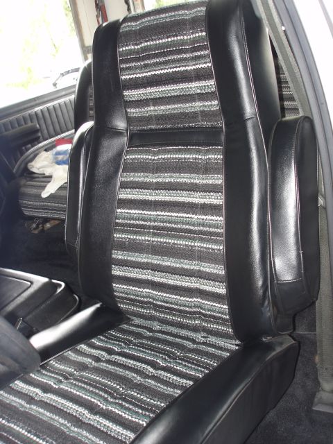 1979 Ford Bronco - Close-up of the interior seats, showing the distinctive striped fabric pattern.