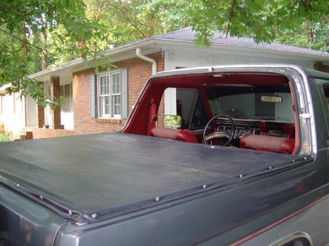 1986 Ford Bronco - View of Bronco with cab bulkhead part of soft top removed but tonneau in place.
