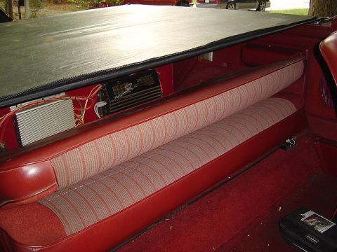 1986 Ford Bronco - Inside view iew of Bronco with cab bulkhead part of soft top removed but tonneau in place.